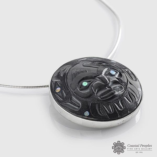Argillite, Abalone shell and Sterling silver Bezel Setting Raven Bringing The Heat Pendant by Northwest Coast Indigenous Artist Andrew Williams